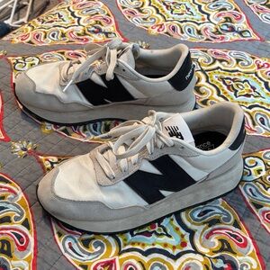 New Balance Cream and Black Athletic Shoes